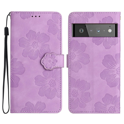 Purple floral embossed leather-style phone case with flip cover and wrist strap