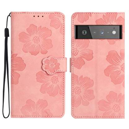 Pink floral embossed leather-style phone case with flip cover and wrist strap