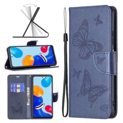 Blue butterfly embossed leather phone case with folio flap and wrist strap.