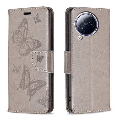 Beige butterfly embossed leather phone case with folio flap and camera cutout.