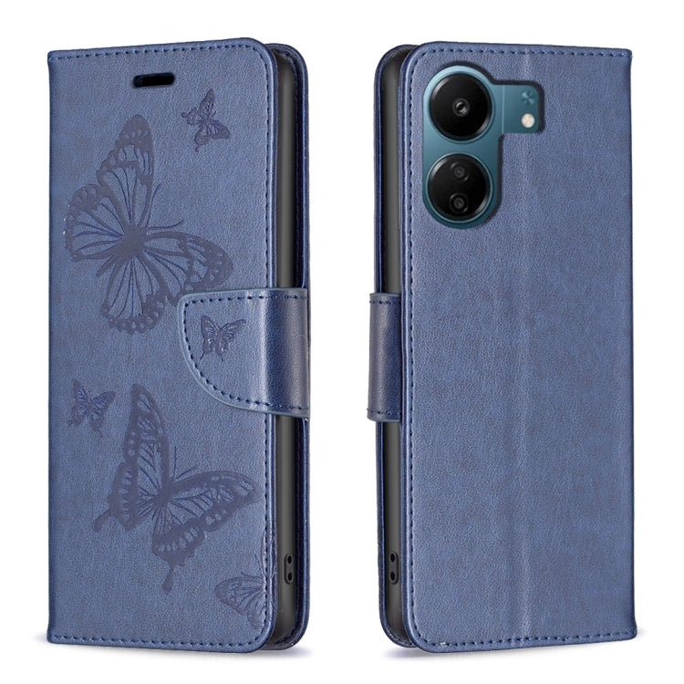 Blue embossed leather phone case with butterfly pattern and folio strap closure