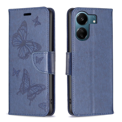 Blue embossed leather phone case with butterfly pattern and folio strap closure