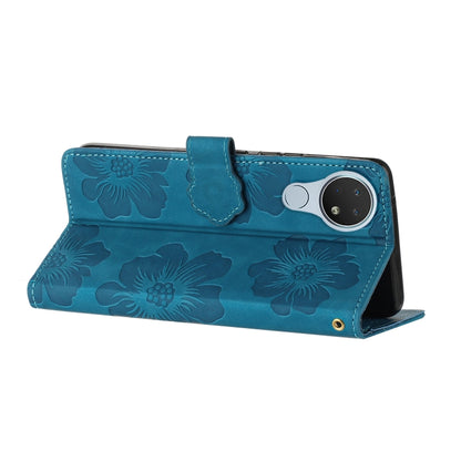 Blue floral embossed leather wallet phone case with side wrist strap and magnetic flap