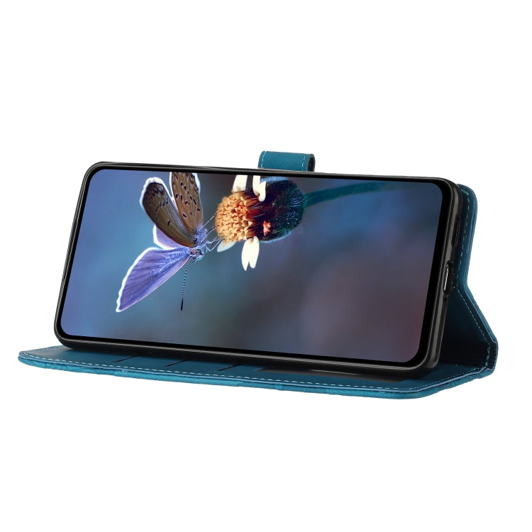 Blue embossed flower leather folio phone case supporting a phone in landscape view