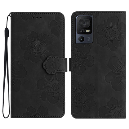 Black floral-embossed folio phone case with flower latch and wrist strap
