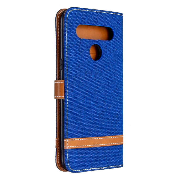 Blue denim flip phone case with top speaker and camera cutouts, brown edge trim