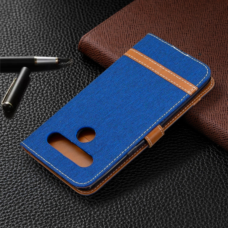 Blue denim wallet phone case with brown trim and camera cutout window