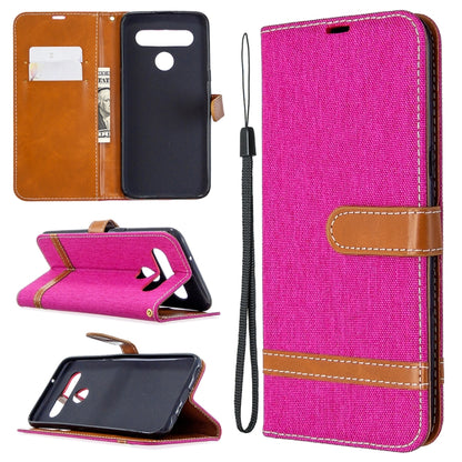 Fuchsia pink denim-texture flip leather phone case with lanyard, card slots, and holder