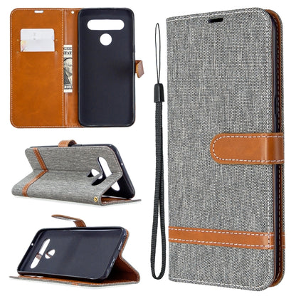 Gray denim-texture flip leather phone case with lanyard, card slots, and stand holder