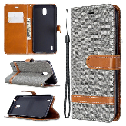Gray flip wallet phone case with card slots, lanyard strap, and folding stand cover.