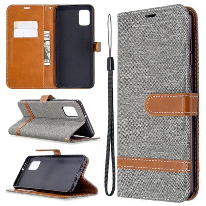 Gray denim phone wallet case with card slots, horizontal flip stand, and wrist lanyard