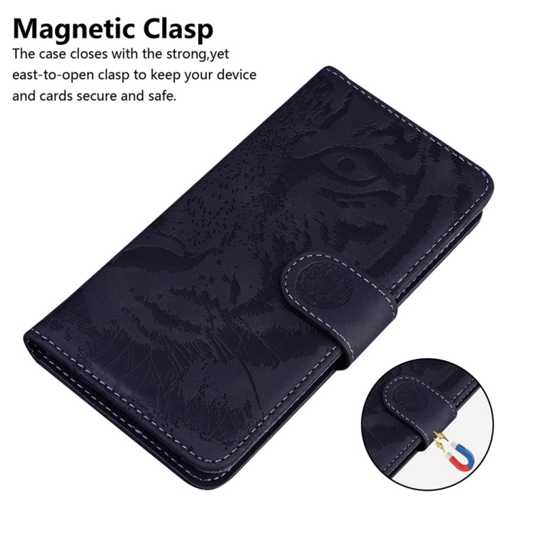 Tiger-embossed flip phone case, dark navy with magnetic clasp tab and stitched trim