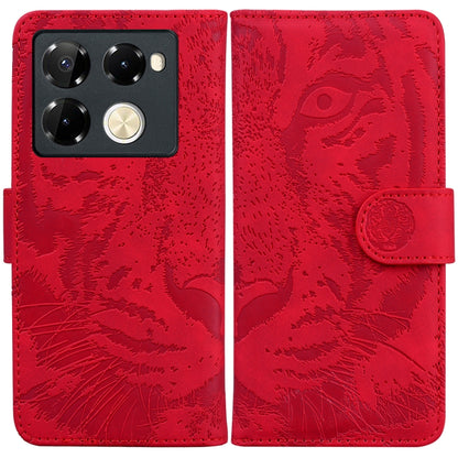 Red tiger-embossed flip leather phone case with camera cutout and side strap