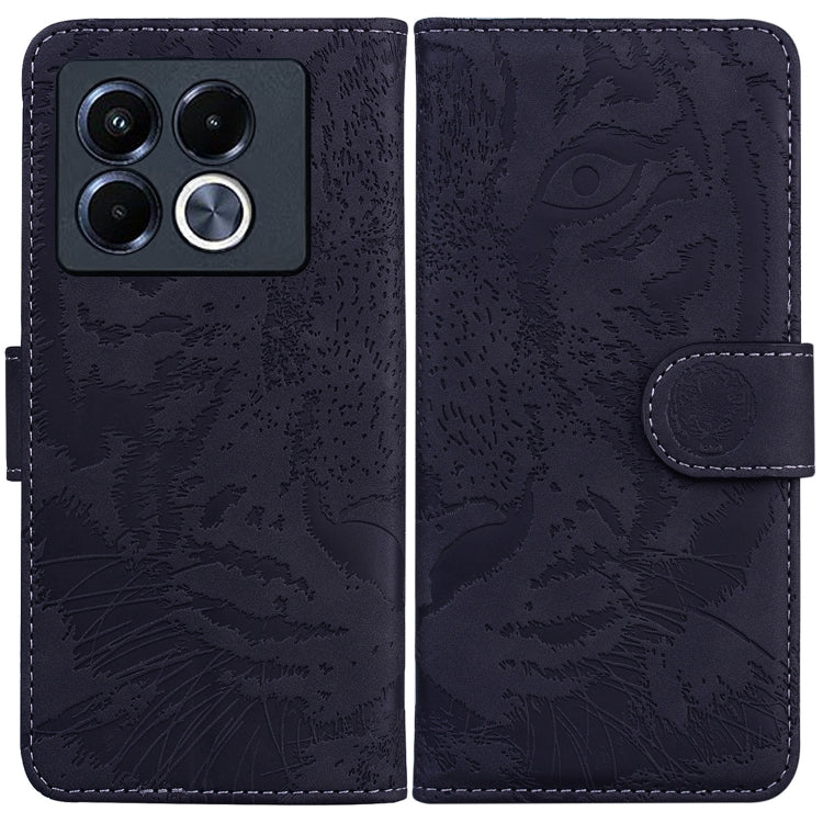 Tiger embossed flip leather phone case, dark navy with magnetic strap closure.