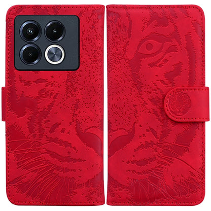 Tiger embossed flip leather phone case, red with magnetic strap closure.
