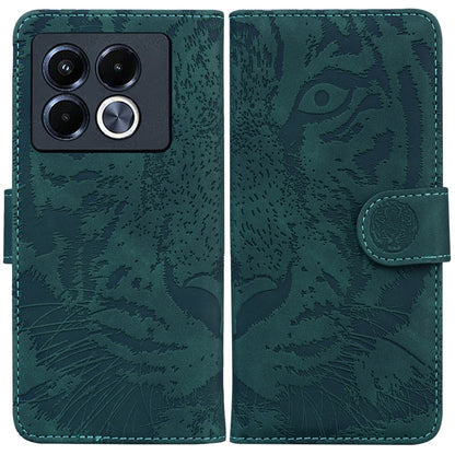 Tiger embossed flip leather phone case, teal with camera cutout and magnetic strap.