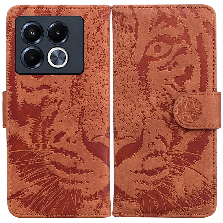 Tiger embossed flip leather phone case, brown with camera cutout and magnetic strap.