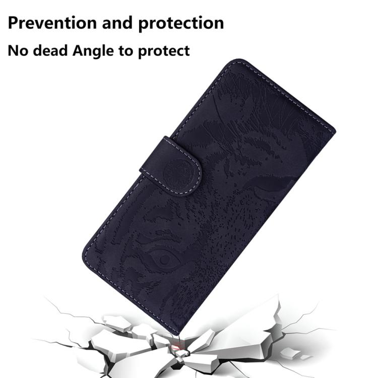 Tiger-embossing leather flip phone case, dark navy, diagonal view with circular clasp.