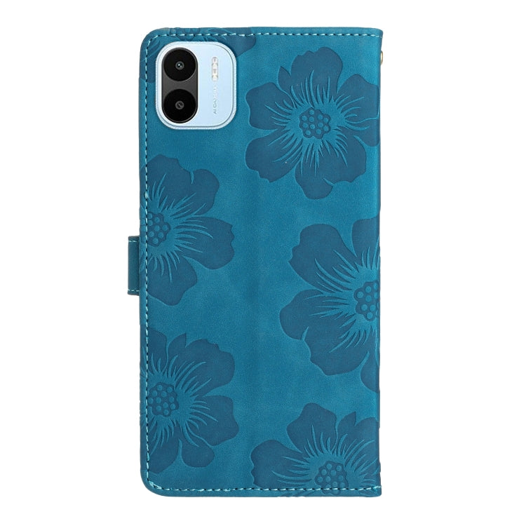 Blue embossed floral leather phone wallet case, back view with camera cutout.