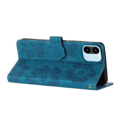 Blue embossed floral leather phone wallet case with flip cover and camera protection.