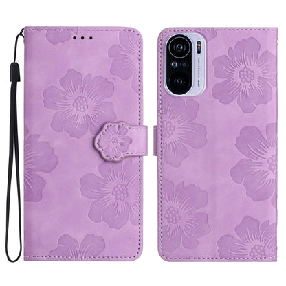 Purple embossed flower leather wallet phone case with magnetic flap and wrist strap