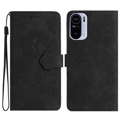 Black embossed flower leather wallet phone case with magnetic flap and cutout camera area