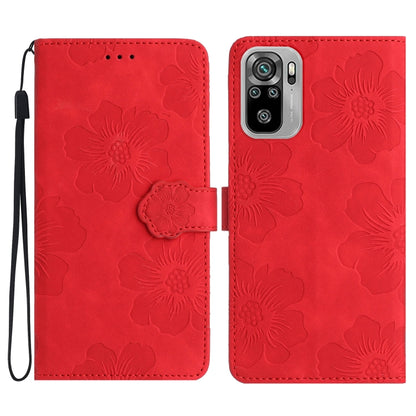Red leather phone case with embossed floral pattern and camera cutout