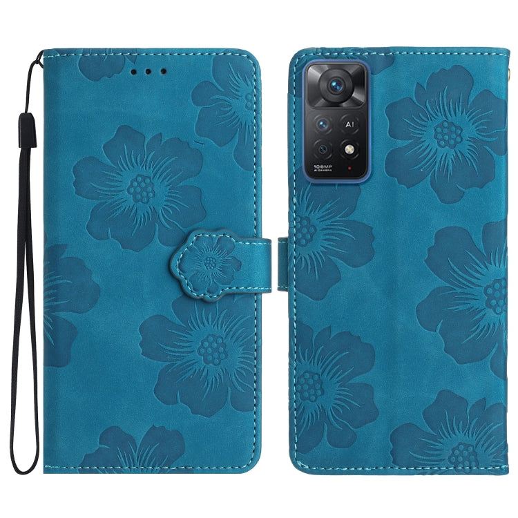 Blue embossed leather phone case with floral pattern, magnetic flap and wrist strap.