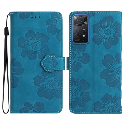 Blue embossed leather phone case with floral pattern, magnetic flap and wrist strap.