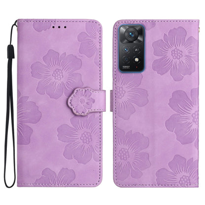 Purple embossed leather phone case with floral pattern, magnetic flap and wrist strap.