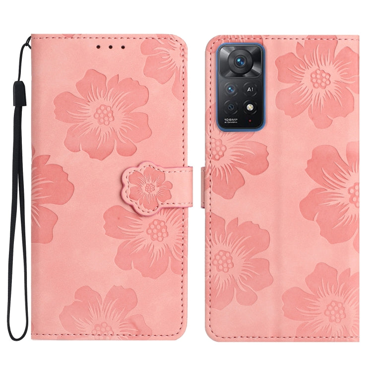 Pink embossed leather phone case with floral pattern, magnetic flap and wrist strap.