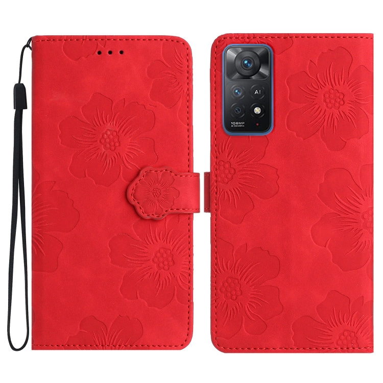 Red embossed leather phone case with floral pattern, magnetic flap and wrist strap.