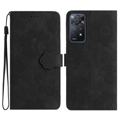 Black embossed leather phone case with floral pattern, magnetic flap and wrist strap.