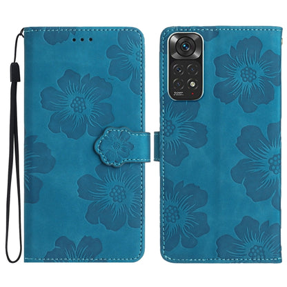 Blue embossed leather phone case with floral pattern, magnetic flap and wrist strap.