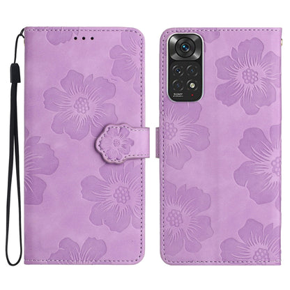 Purple embossed leather phone case with floral pattern, magnetic flap and wrist strap.