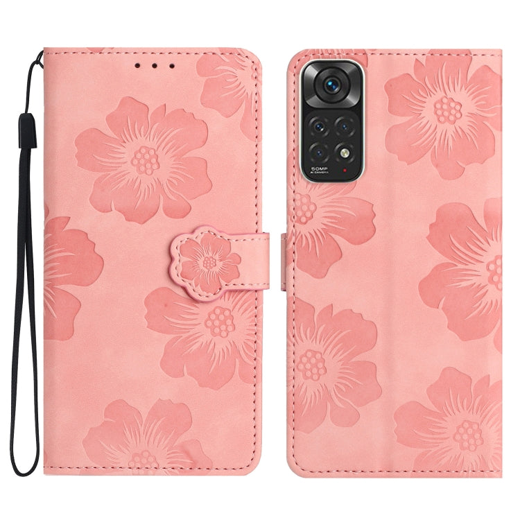 Pink embossed leather phone case with floral pattern, magnetic flap and wrist strap.