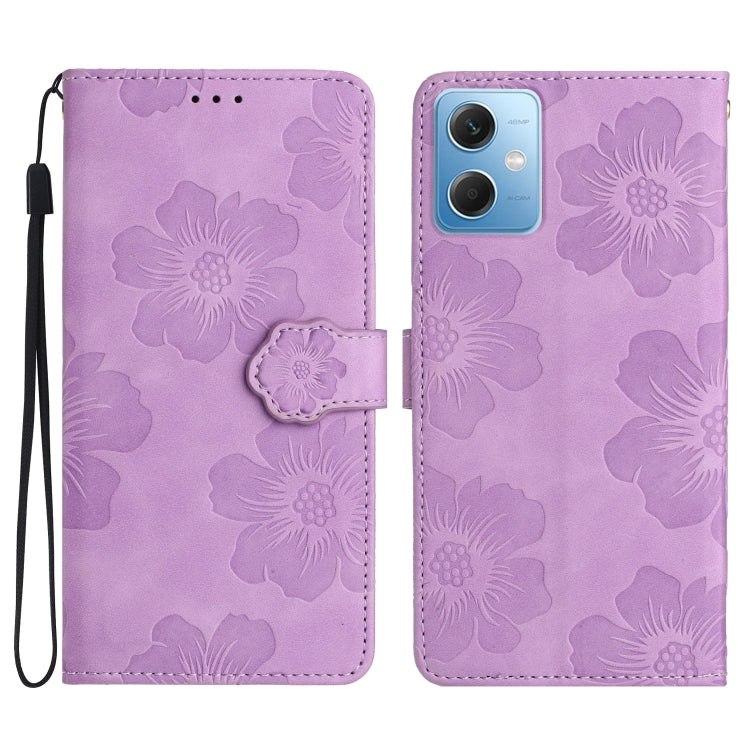 Purple embossed flower leather flip phone case with wrist strap and camera cutout