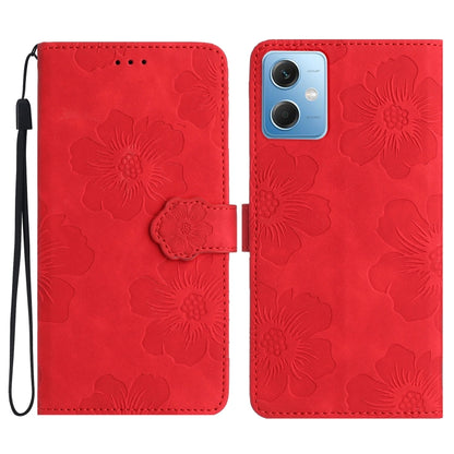 Red embossed flower leather flip phone case with wrist strap and camera cutout