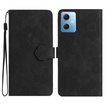 Black embossed flower leather flip phone case with wrist strap and camera cutout