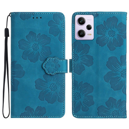 Blue embossed flower leather flip phone case with wrist strap and camera cutout