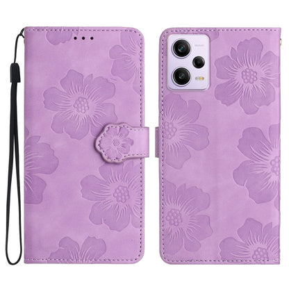 Purple embossed flower leather flip phone case with wrist strap and camera cutout