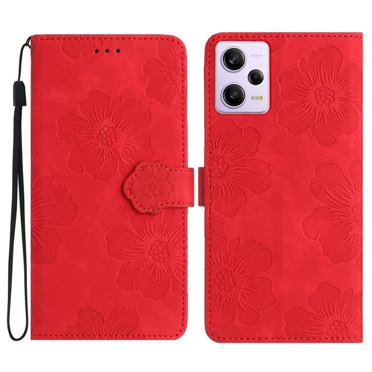 Red embossed flower leather flip phone case with wrist strap and camera cutout