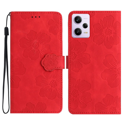 Red embossed flower leather flip phone case with wrist strap and camera cutout