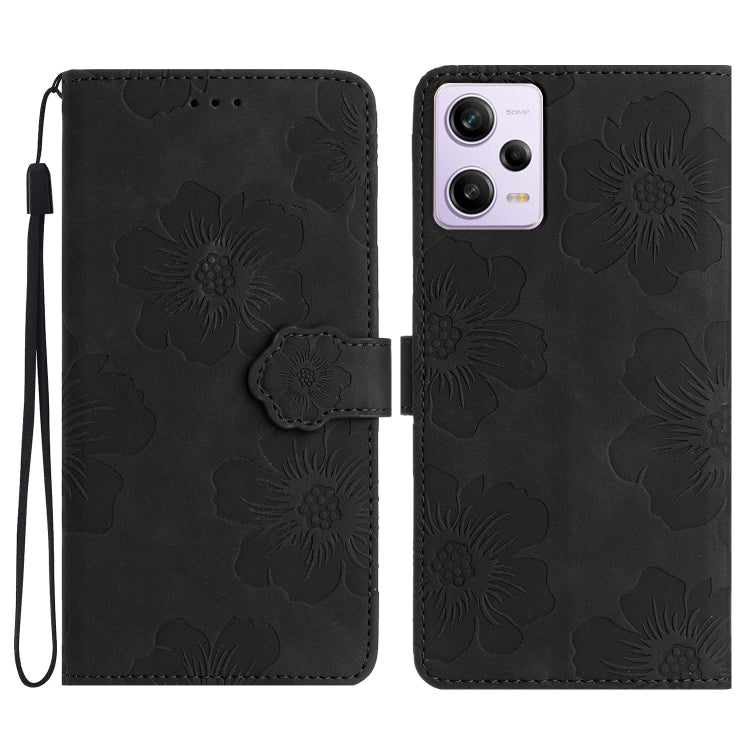Black floral embossed leather wallet phone case with wrist strap and magnetic flap