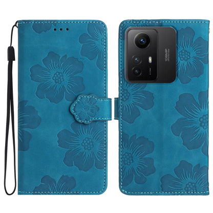 Blue floral embossed leather wallet phone case with wrist strap and magnetic flap