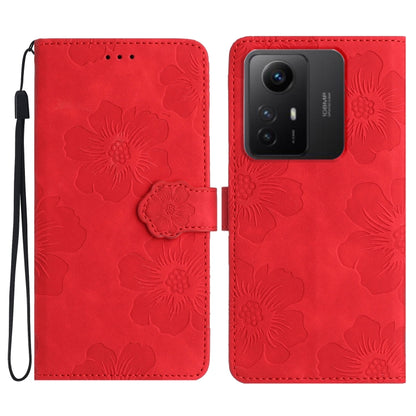 Red floral embossed leather wallet phone case with wrist strap and magnetic flap