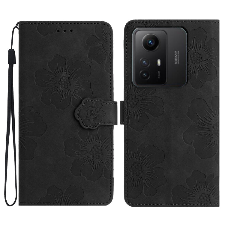 Black floral embossed leather wallet phone case with wrist strap and magnetic flap