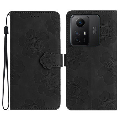 Black floral embossed leather wallet phone case with wrist strap and magnetic flap