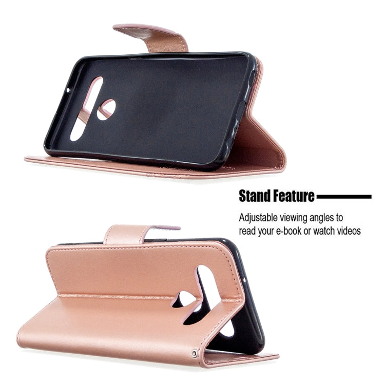 Pink leather-style wallet case with flip stand for viewing, embossed butterflies
