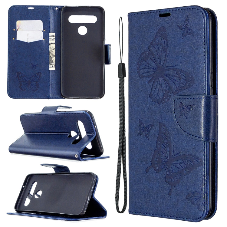Dark blue leather-style phone wallet case with embossed butterflies, card slots, and wrist strap